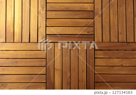 Decorative surface made of brown wooden slats. Decorative surface made of brown wooden slats. 127134163
