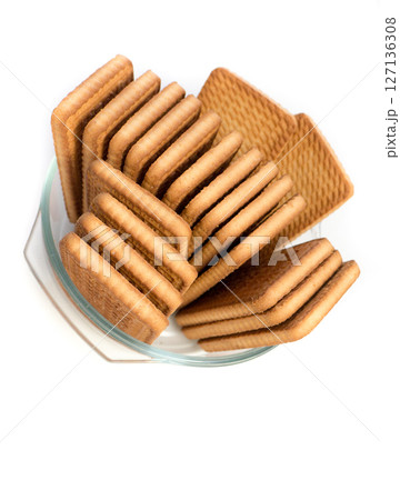 Cookies in a glass plate on a white background. Cookies in a glass plate on a white background. 127136308