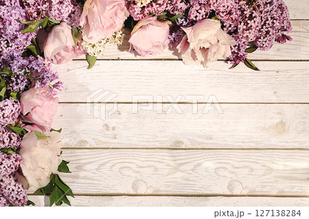 Abstract floral composition and banner for screen, Beautiful spring blooming branches of lilac and mountain peony on sunny background. Still life with place for text, Floral holiday card Abstract floral composition and banner for screen, Beautiful spring blooming branches of lilac and mountain peony on sunny background. Still life with place for text, Floral holiday card 127138284