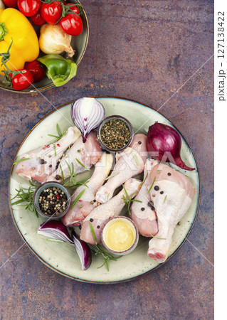 Uncooked raw chicken legs. Uncooked raw chicken legs. 127138422
