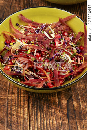 Plate with raw sprouts salad. 127138448