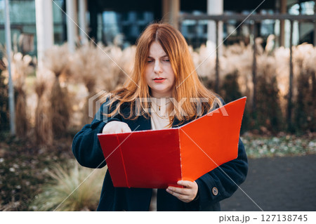 Businesswoman successful woman business person standing outdoor corporate building exterior. Elegance pretty caucasian professional 30s female Bank worker posing outdoors Businesswoman successful woman business person standing outdoor corporate building exterior. Elegance pretty caucasian professional 30s female Bank worker posing outdoors 127138745