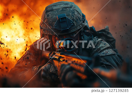 Modern soldier engages in combat during intense battlefield situation 127139285