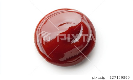 Bright red ketchup dollop on a clean white surface ready for dipping or drizzling on food items 127139899