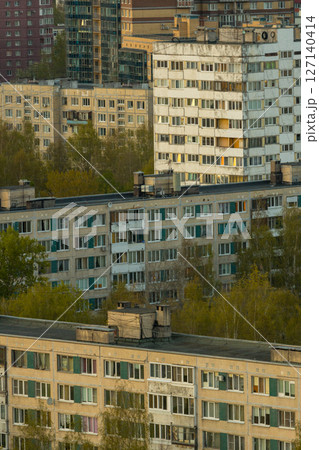 urban landscape with tall buildings and several trees, residential area, multi-storey buildings. urban landscape with tall buildings and several trees, residential area, multi-storey buildings. 127140414