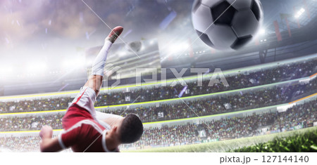 Soccer. A footballer performs a powerful overhead kick while falling. Soccer action game. Rear view. Big stadium Soccer. A footballer performs a powerful overhead kick while falling. Soccer action game. Rear view. Big stadium 127144140