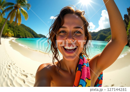 A joyful woman on a tropical beach. 127144281
