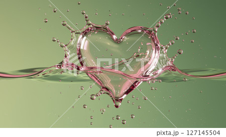 緑の背景にピンク色のハート型ウォータースプラッシュ 127145504