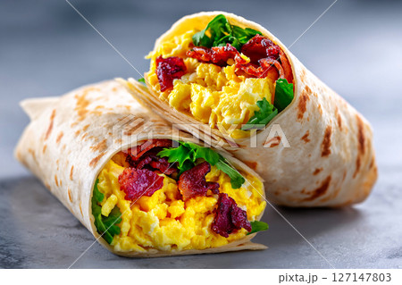 Tempting burrito glows in studio light, set in an industrial corner on pale gray background 127147803