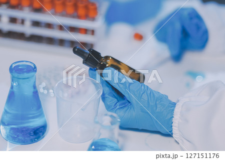 Research, experiment and medical trial being done by a scientist in a lab, science facility or hospital. One young, serious and professional researcher organizing, sorting or making a discovery Research, experiment and medical trial being done by a scientist in a lab, science facility or hospital. One young, serious and professional researcher organizing, sorting or making a discovery 127151176