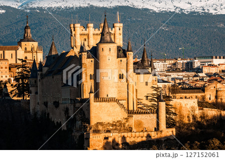 The Alcazar of Segovia stands majestically against the Guadarrama mountains in Spain. The Alcazar of Segovia stands majestically against the Guadarrama mountains in Spain. 127152061