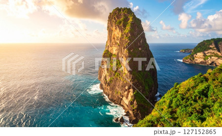 Tropical summer sky and blue ocean water surround a stunning Thailand island rock landscape 127152865