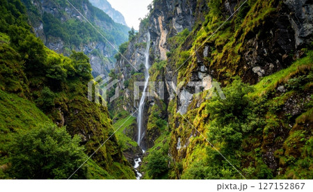 mountain waterfall in a green summer landscape with flowing water 127152867