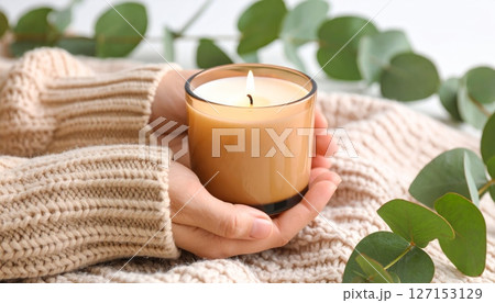 Tranquil spa setting with flickering candles and aromatic flowers for ultimate relaxation and wellness 127153129