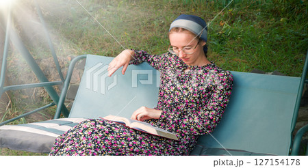 Pretty girl reading a book 127154178