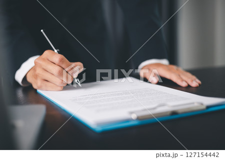 Business people signing contract making deal with life insurance agent Concept for consultant health insurance life insurance savings plan. Approved stamp with Business people contract making deal Business people signing contract making deal with life insurance agent Concept for consultant health insurance life insurance savings plan. Approved stamp with Business people contract making deal 127154442