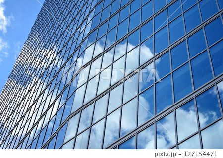 Modern sustainable glass office buildings. Exterior view of corporate headquarters glass buildings architecture.Glass windows in energy-efficient buildings. Financial business center buildings. Modern sustainable glass office buildings. Exterior view of corporate headquarters glass buildings architecture.Glass windows in energy-efficient buildings. Financial business center buildings. 127154471
