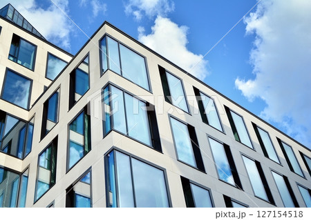 Modern sustainable glass office buildings. Exterior view of corporate headquarters glass buildings architecture.Glass windows in energy-efficient buildings. Financial business center buildings. Modern sustainable glass office buildings. Exterior view of corporate headquarters glass buildings architecture.Glass windows in energy-efficient buildings. Financial business center buildings. 127154518