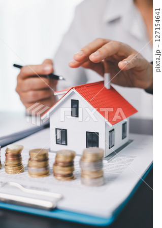 Concept business house finance protection office plan investment buy sell home ensuring idea financial security. residence agent hand protect purchase insurance and secure favorable loan deal. Concept business house finance protection office plan investment buy sell home ensuring idea financial security. residence agent hand protect purchase insurance and secure favorable loan deal. 127154641