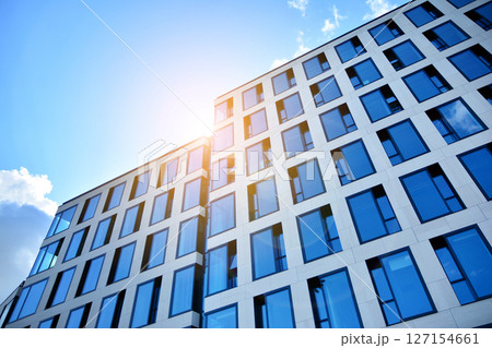 Modern sustainable glass office buildings. Exterior view of corporate headquarters glass buildings architecture.Glass windows in energy-efficient buildings. Financial business center buildings. Modern sustainable glass office buildings. Exterior view of corporate headquarters glass buildings architecture.Glass windows in energy-efficient buildings. Financial business center buildings. 127154661