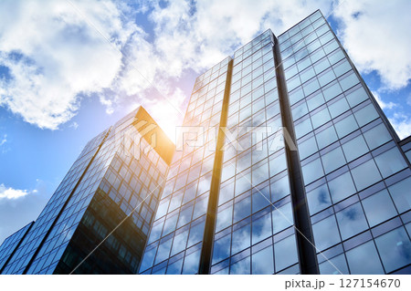 Modern sustainable glass office buildings. Exterior view of corporate headquarters glass buildings architecture.Glass windows in energy-efficient buildings. Financial business center buildings. Modern sustainable glass office buildings. Exterior view of corporate headquarters glass buildings architecture.Glass windows in energy-efficient buildings. Financial business center buildings. 127154670