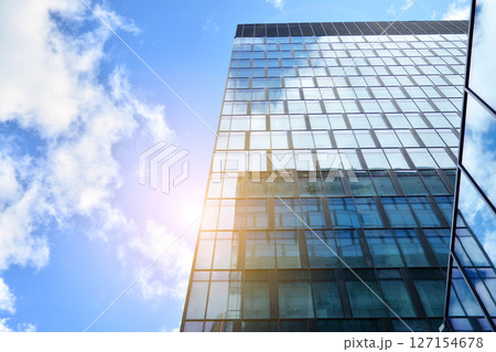Modern sustainable glass office buildings. Exterior view of corporate headquarters glass buildings architecture.Glass windows in energy-efficient buildings. Financial business center buildings. Modern sustainable glass office buildings. Exterior view of corporate headquarters glass buildings architecture.Glass windows in energy-efficient buildings. Financial business center buildings. 127154678