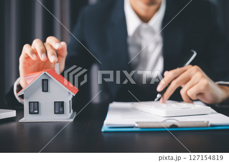 Concept business house finance protection office plan investment buy sell home ensuring idea financial security. residence agent hand protect purchase insurance and secure favorable loan deal. 127154819