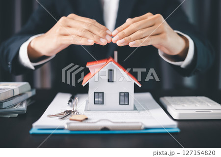 Concept business house finance protection office plan investment buy sell home ensuring idea financial security. residence agent hand protect purchase insurance and secure favorable loan deal. Concept business house finance protection office plan investment buy sell home ensuring idea financial security. residence agent hand protect purchase insurance and secure favorable loan deal. 127154820