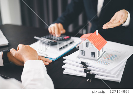 Concept business house finance protection office plan investment buy sell home ensuring idea financial security. residence agent hand protect purchase insurance and secure favorable loan deal. 127154995
