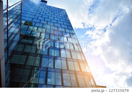 Modern sustainable glass office buildings. Exterior view of corporate headquarters glass buildings architecture.Glass windows in energy-efficient buildings. Financial business center buildings. Modern sustainable glass office buildings. Exterior view of corporate headquarters glass buildings architecture.Glass windows in energy-efficient buildings. Financial business center buildings. 127155079