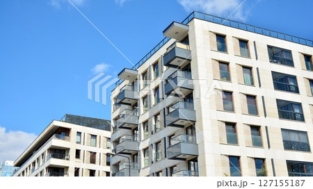 Modern new residential apartment house building complex. Exterior view of modern apartment building. New construction apartment or condo complex. 127155187