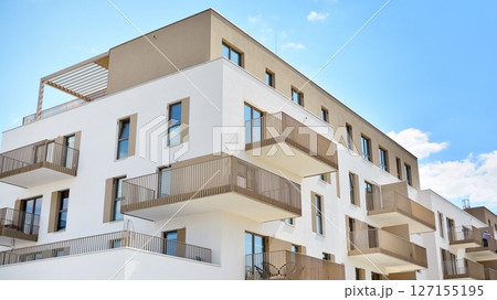 Modern new residential apartment house building complex. Exterior view of modern apartment building. New construction apartment or condo complex. 127155195