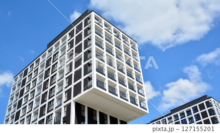 Modern new residential apartment house building complex. Exterior view of modern apartment building. New construction apartment or condo complex. 127155201