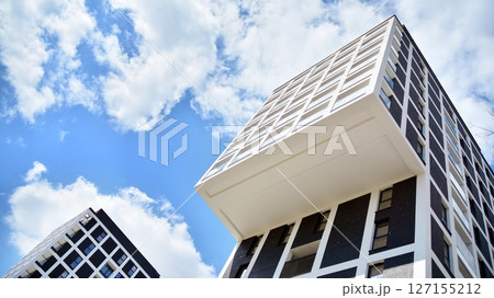 Modern new residential apartment house building complex. Exterior view of modern apartment building. New construction apartment or condo complex. Modern new residential apartment house building complex. Exterior view of modern apartment building. New construction apartment or condo complex. 127155212