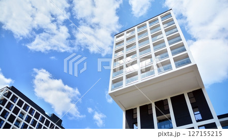 Modern new residential apartment house building complex. Exterior view of modern apartment building. New construction apartment or condo complex. Modern new residential apartment house building complex. Exterior view of modern apartment building. New construction apartment or condo complex. 127155215