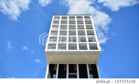 Modern new residential apartment house building complex. Exterior view of modern apartment building. New construction apartment or condo complex. 127155216