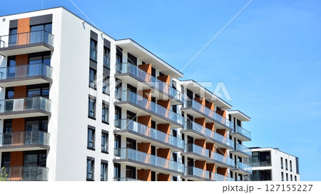 Modern new residential apartment house building complex. Exterior view of modern apartment building. New construction apartment or condo complex. Modern new residential apartment house building complex. Exterior view of modern apartment building. New construction apartment or condo complex. 127155227