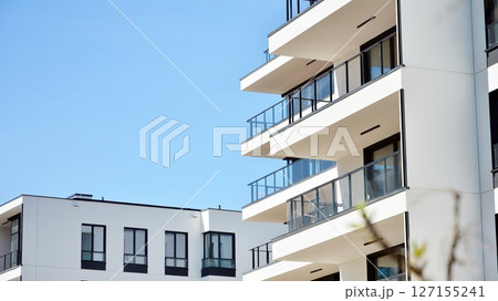 Modern new residential apartment house building complex. Exterior view of modern apartment building. New construction apartment or condo complex. 127155241