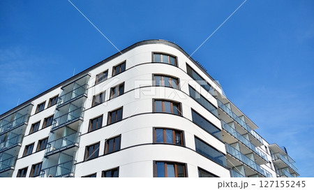 Modern new residential apartment house building complex. Exterior view of modern apartment building. New construction apartment or condo complex. Modern new residential apartment house building complex. Exterior view of modern apartment building. New construction apartment or condo complex. 127155245