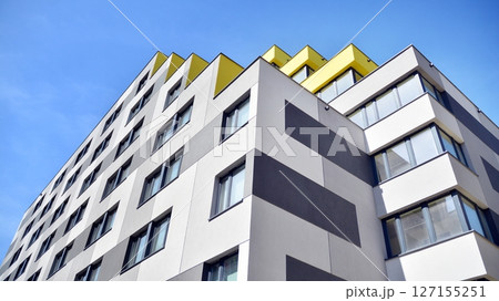 Modern new residential apartment house building complex. Exterior view of modern apartment building. New construction apartment or condo complex. Modern new residential apartment house building complex. Exterior view of modern apartment building. New construction apartment or condo complex. 127155251