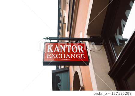 Currency Exchange Office Sign on Building 127155298