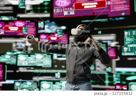 Male spy bypasses network security and engages in cyber intrusion with vr glasses, programming code for data breach and identity theft. Covert cyber operations through infiltration. Male spy bypasses network security and engages in cyber intrusion with vr glasses, programming code for data breach and identity theft. Covert cyber operations through infiltration. 127155812