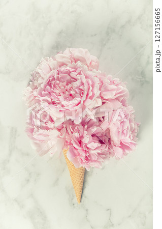 Pink Peony Bouquet in Ice Cream Cone on Marble Surface 127156665