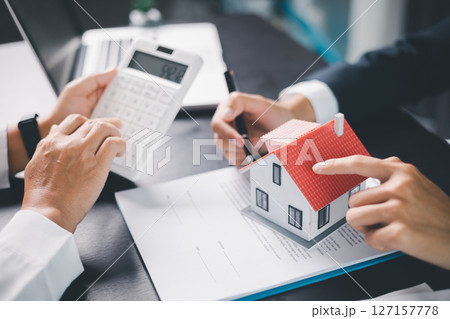 Concept business house finance protection office plan investment buy sell home ensuring idea financial security. residence agent hand protect purchase insurance and secure favorable loan deal. 127157778