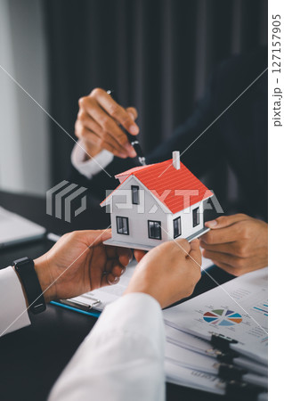Concept business house finance protection office plan investment buy sell home ensuring idea financial security. residence agent hand protect purchase insurance and secure favorable loan deal. 127157905
