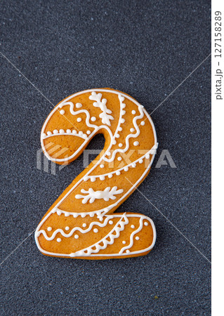 Decorated Gingerbread Cookie Number Two. Food background. Christmas decor. Decorated Gingerbread Cookie Number Two. Food background. Christmas decor. 127158289