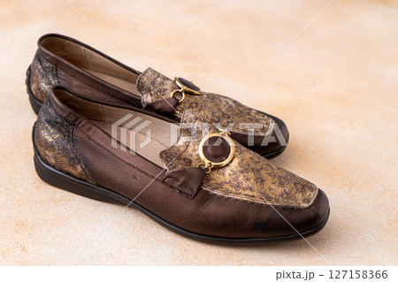 Pair of leather shoes. Brown classic moccasins. Loafers footwear. Pair of leather shoes. Brown classic moccasins. Loafers footwear. 127158366