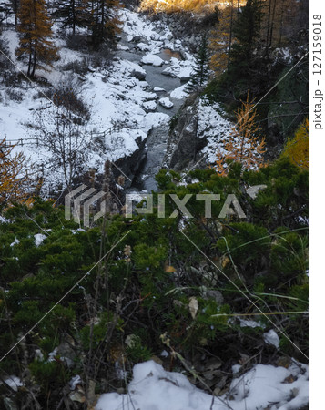 Snowy alpine valley near aosta, italy, revealing verdant landscape and golden hued trees during late autumn season Lillaz Snowy alpine valley near aosta, italy, revealing verdant landscape and golden hued trees during late autumn season Lillaz 127159018