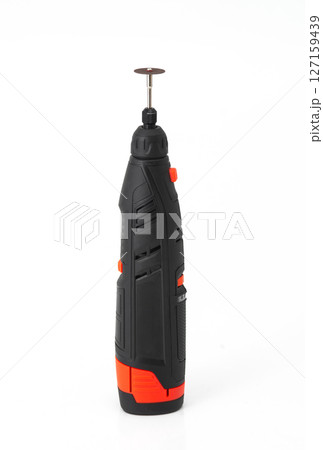 Close-up of a cordless rotary tool with cutting disc, isolated on white background, used for DIY, crafting, and precision work. 127159439