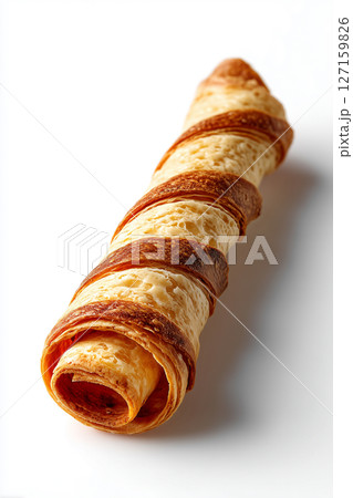 Flaky pastry roll lies on clean white surface, showcasing its crispy texture and golden layers. This minimalist aesthetic highlights culinary artistry, ideal for bakery, catering, dessert shop Flaky pastry roll lies on clean white surface, showcasing its crispy texture and golden layers. This minimalist aesthetic highlights culinary artistry, ideal for bakery, catering, dessert shop 127159826